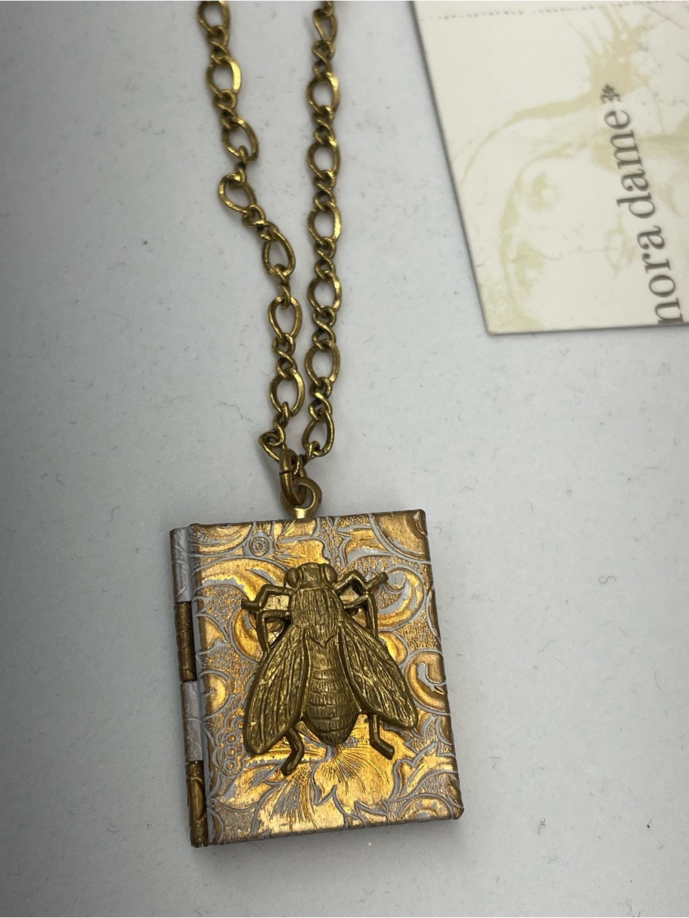 Gold-Tone Embossed Book Locket Necklace with Bee Accent